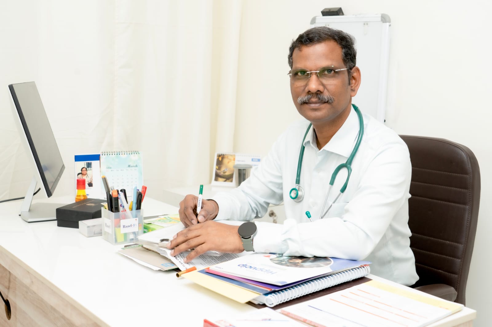 Dr. C. Elamaran